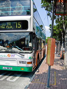 New World First Bus number 15 Standing at the Ferry Pier bus stop waiting to take passengers to Victoria Peak aka The Peak